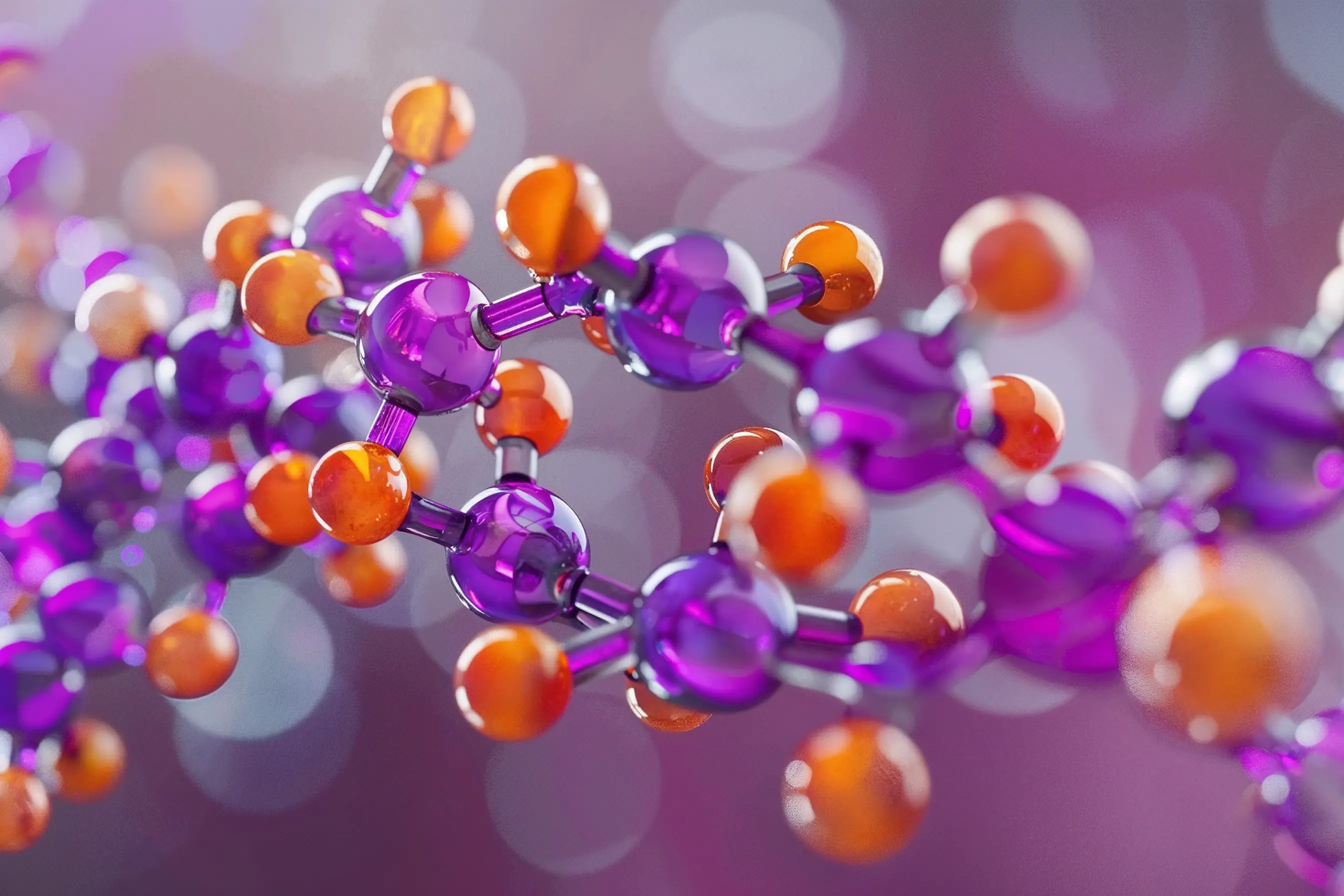 Illustration of a complex molecular structure, featuring interconnected purple and orange spheres.